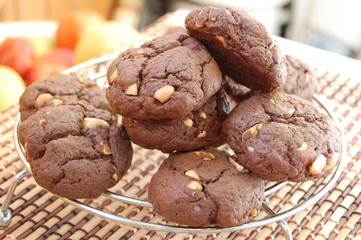 Close up of rows of chocolate cookies with peanut butter chips