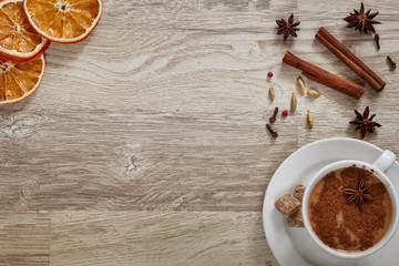 Masala tea in a white cup with spices