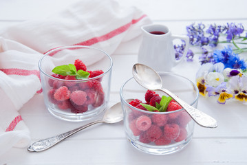 Fresh Organic Raspberries in glasses for Breakfast 