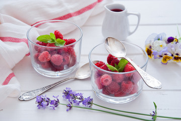 Fresh Organic Raspberries in glasses for Breakfast 