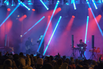 Street life at night. Open Air Show at Moscow street. Defocused image.