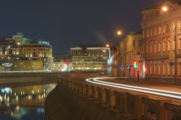 Fototapeta na wymiar City streets in spring night. Brightly illuminated Moscow. Long exposure image. 