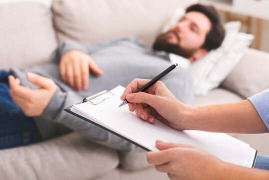 Patient lying on sofa at pcychological therapy