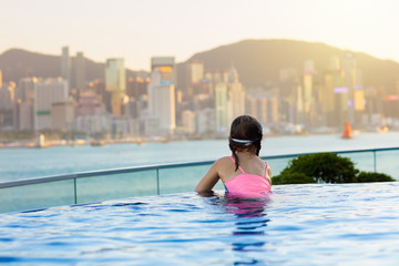 Kids swim in Hong Kong roof top swimming pool