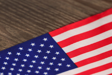 Fototapeta na wymiar american flag on wooden background soft focus close up