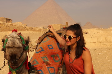 woman in pyramids of Egypt with camel