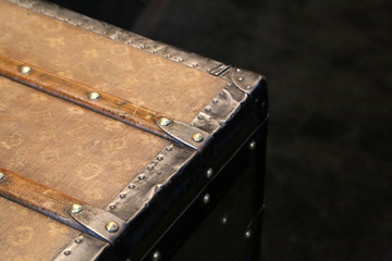 Fragment of an old chest with metal corners