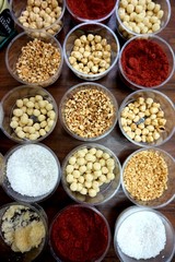 Various spices, nuts and additives on the table.