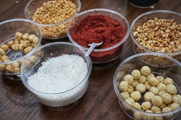 Various spices, nuts and additives on the table.