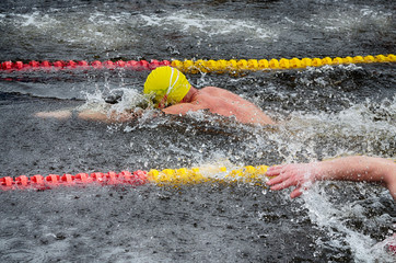 Lovers of winter swimming.Swimmer swims in the pool.
