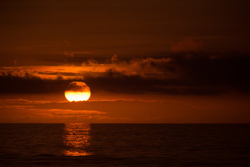 Sun behind clouds on a fired sky 6