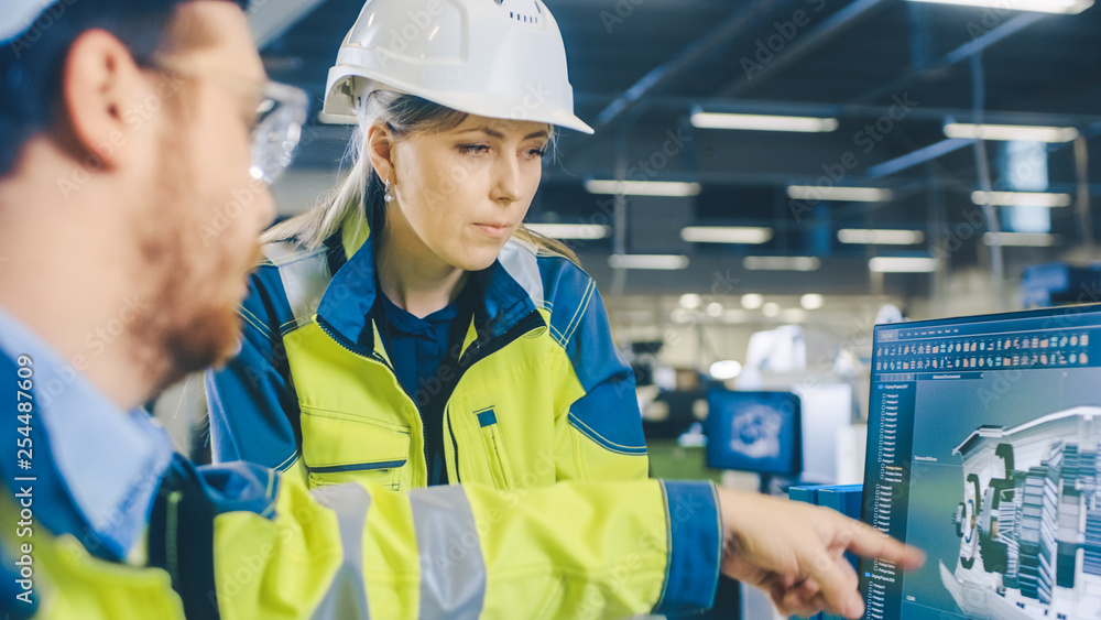 Aufkleber inside factory male mechanical engineer and female chief engineer work together on the personal comp