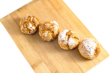 Fresh home made buns with custard cream and powdered sugar