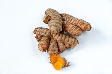 Turmeric root on white background.