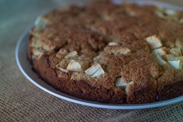 Homemade Healthy Vegan Oat apple pie pastry on burlap surface. Very Healthy Dessert concept.