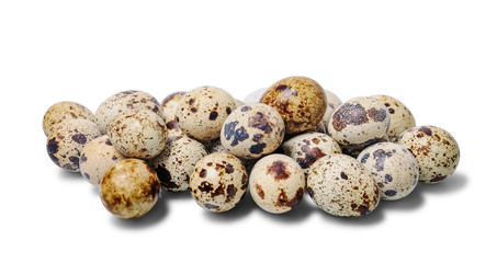 A lot of quail eggs isolated on a white background. Selective focus.