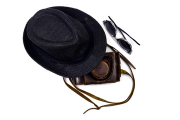 8.	 Black hat, dark sunglasses and leather antique camera case with belt on the isolated white...
