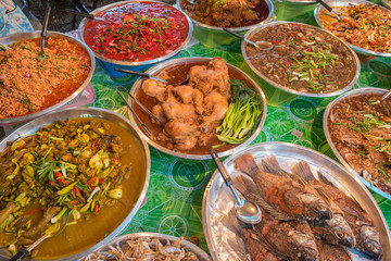 Various Thai dishes on the stall at a market in Ao Nang, Krabi, Thailand.