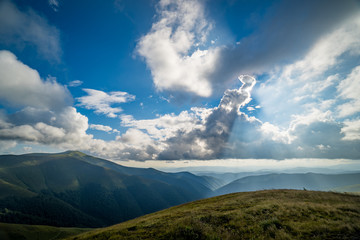 Landscape of Borzhava ridge of the Ukrainian Carpathian Mountains. Clouds above Carpathians