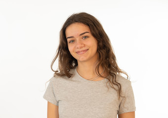 Fototapeta premium Human expressions and emotions. Portrait of young attractive girl with smiling happy face