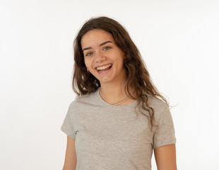 Fototapeta premium Human expressions and emotions. Portrait of young attractive girl with smiling happy face
