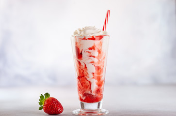 Strawberry milkshake with whipped cream.