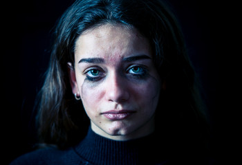 Fototapeta premium Sad young girl crying and suffering harassment online. Cyberbullying and dangers of internet.
