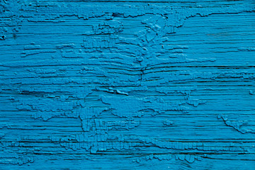 Obraz premium The wooden wall of an old Christian temple. Blu wooden wall background, vintage wooden background. 