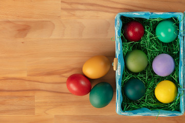Top view of colorful easter eggs in box