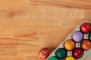 Top view of colorful easter eggs in box