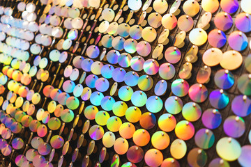 Bright, festive, sparkling, dazzling, abstract background. Festive decorations and decoration of round shiny metallic sequins. 