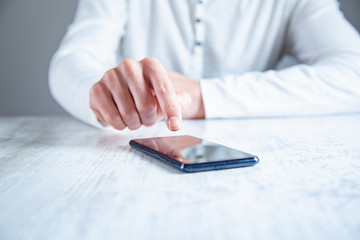 Fototapeta premium young man hand holding phone