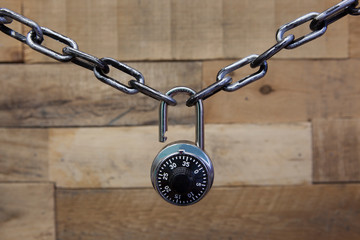 Security Series Chained Black Padlock Wooden Background