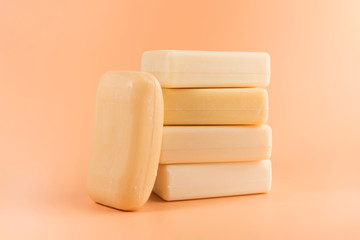 pieces of natural soap isolated on the orange background