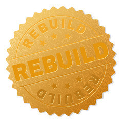 REBUILD gold stamp award. Vector golden medal with REBUILD text. Text labels are placed between parallel lines and on circle. Golden skin has metallic structure.
