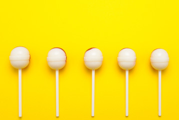 Lollipop on a yellow background. Space for text or design.
