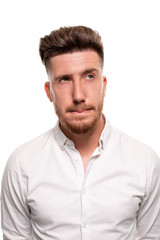 Fototapeta premium Studio photo of a good-looking man in a white shirt, isolated over a white background