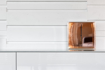 Modern clock on dresser