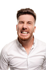 Obraz premium Studio photo of a good-looking man in a white shirt, isolated over a white background