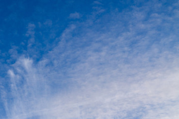 Fototapeta premium Blue sky with clouds and sun reflection in water with place for your text. blue sky background with white clouds
