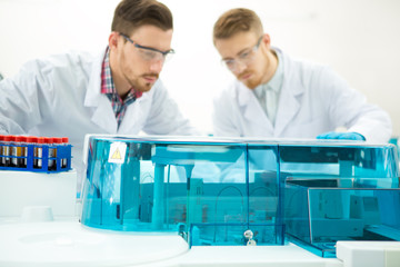 Two male scientists working at the laboratory