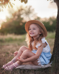 Summer outdoor portrait of beautiful happy child