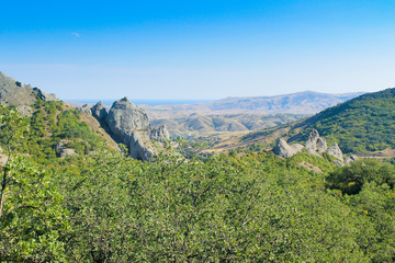 Landscape. Mountains, forest, sea and blue sky