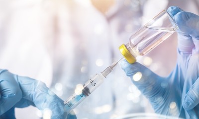Human Hands with injection Syringe and medicine