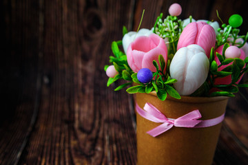 Happy mother's Day, women's day, Birthday or wedding greeting concept. Bouquet of crocuses on a blurred background. Spa romantic concept. Soap handmade form of flowers. Place for text.