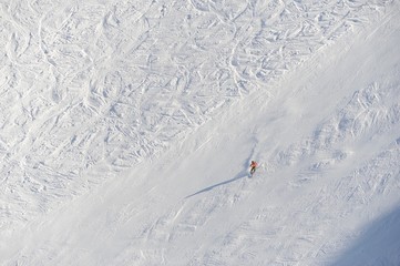 Skiing person at black slope 