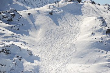 Fototapeta na wymiar Empty ski slope in French Alps at winter 