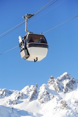 Ski lift in mountain with winter background 