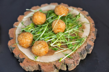 cheese balls with arugula closeup
