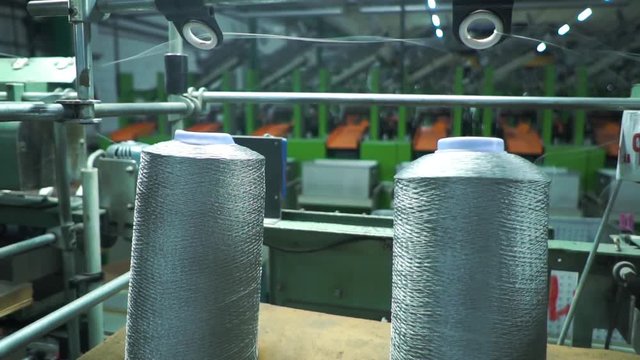 two bobbins with nylon thread, polyamide used for the manufacture of knitted clothing. Close up